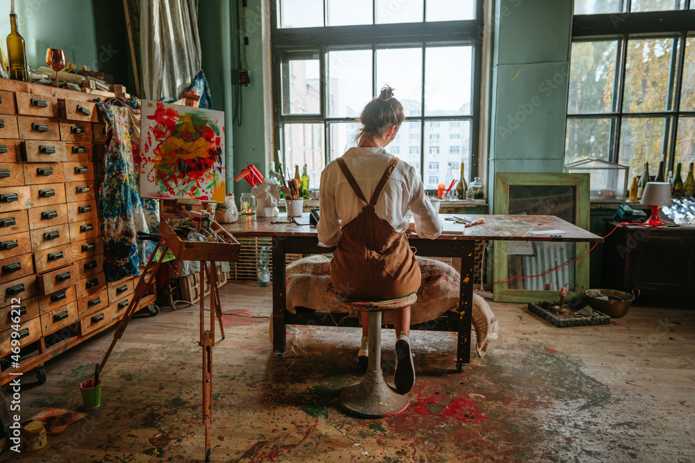 An artist at work in a Whirled Art studio